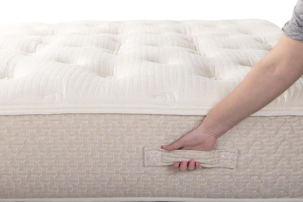 woman reaching for the lytton mattress handle