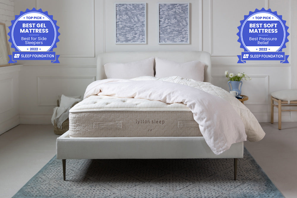 lytton mattress on bed frame with white comforter draped over the top