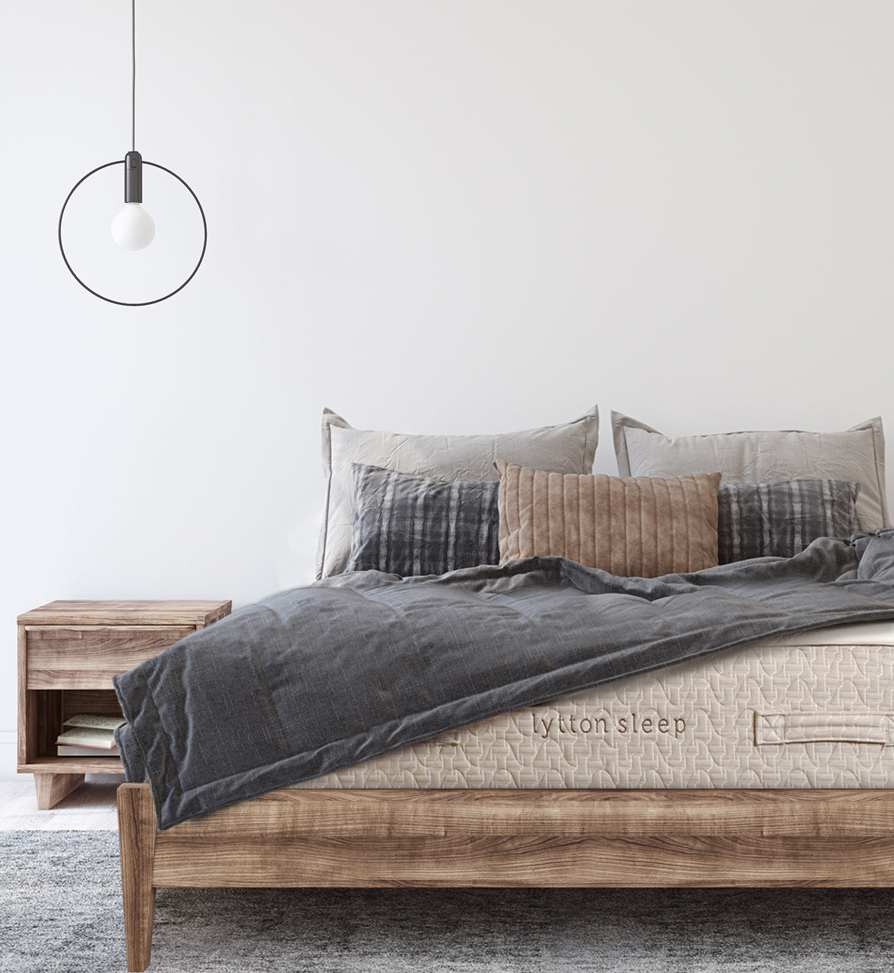 Lytton mattress on rustic bedframe and dark gray comforter