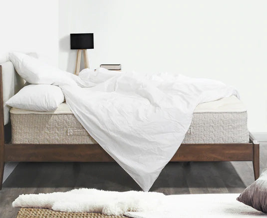 Naked Lytton Mattress with pillows on top